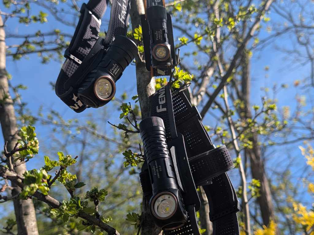 Size comparison of Fenix HM61R Amber, HM53R Garnet, and HM51R Ruby headlamps